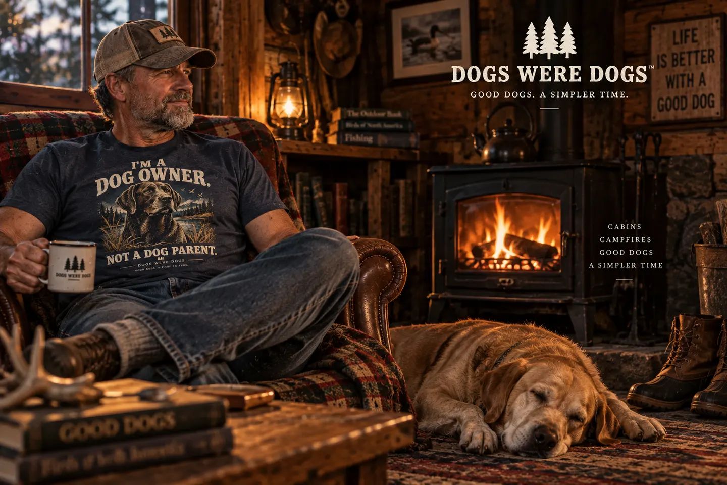 A man reads in a leather chair by lamplight with a Labrador beside him, wearing a Dogs Were Dogs Dog Owner t-shirt, the room warm with wood tones.